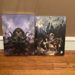 Malleus Monstrorum and A Time to Harvest standing against a wall.