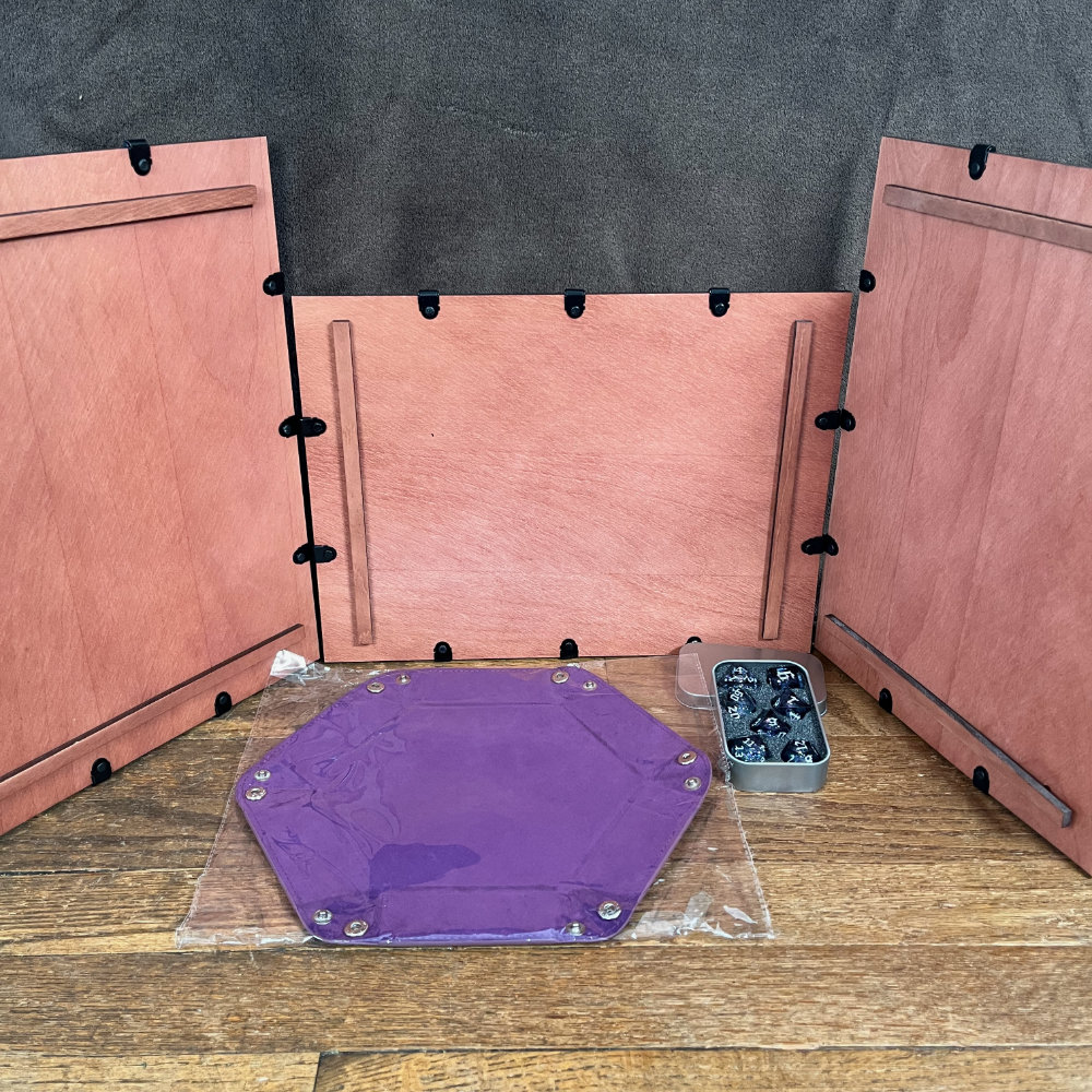 A magnetic GM screen (3 panels) and a purple dice tray.