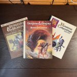 Left to right: AC2 DM Screen, The Rules Cyclopedia, and the Mystara appendix of the Monstrous Compendium.