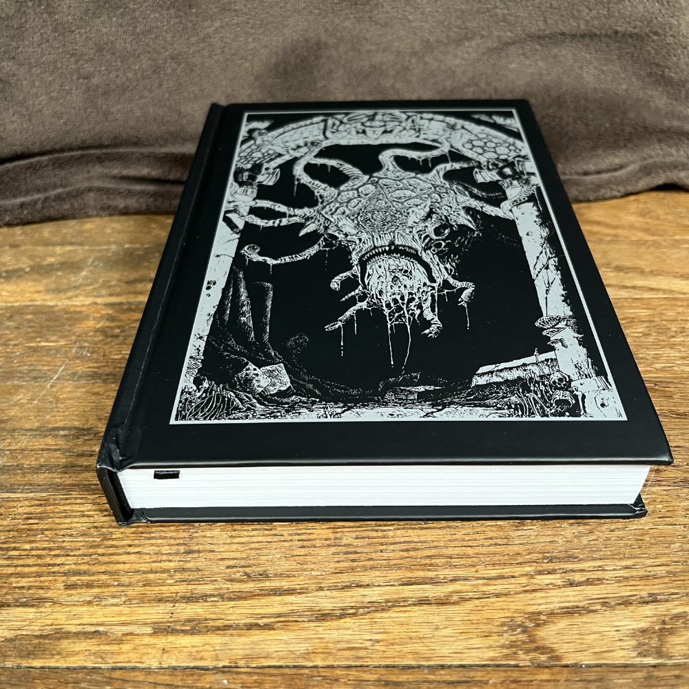 Product shot of Shadowdark, with a gruesome beast on the front cover in silver.