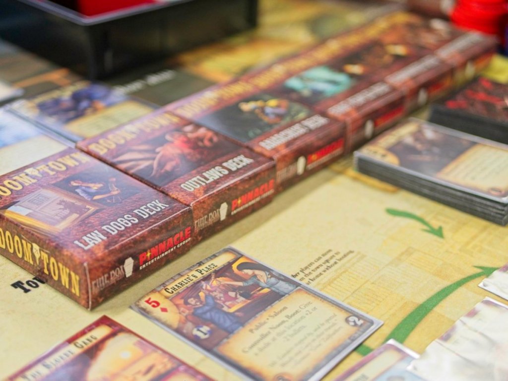 Doomtown collectable card game demo, "Charlie's Place" is in focus.