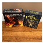 Dresden Files Cooperative Card Game and Rites of Cthulhu card game boxes.